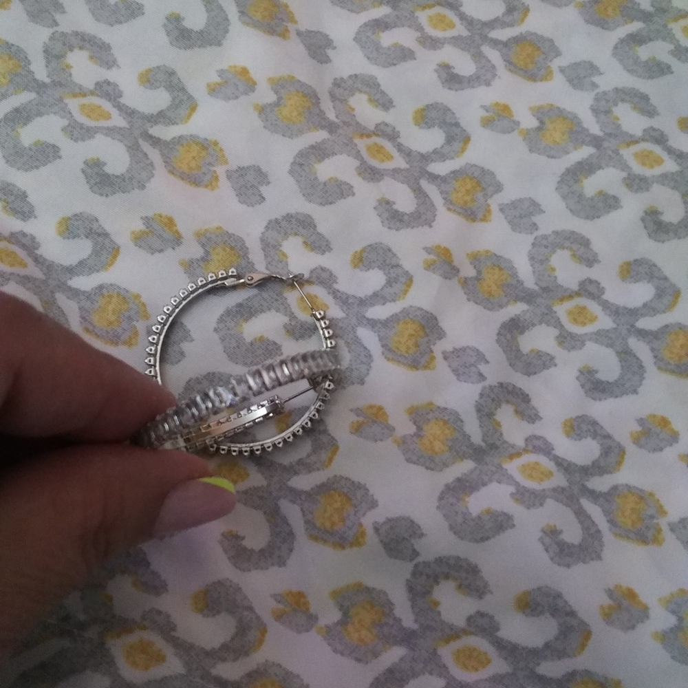 Brand new no tag . Sterling silver hoop style earring.